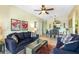 Cozy living room with comfortable seating, opening to a dining area and featuring stylish décor at 2302 Silver Palm Dr # 203, Kissimmee, FL 34747