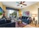 Inviting living room with sliding glass doors to a balcony, comfortable sofas, and decorative accents at 2302 Silver Palm Dr # 203, Kissimmee, FL 34747