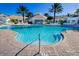 Bright and inviting community swimming pool with lounge chairs for relaxing at 2302 Silver Palm Dr # 203, Kissimmee, FL 34747