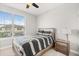 Cozy bedroom with a large window providing natural light and a calming color scheme at 2405 Standing Rock Cir, Oakland, FL 34787