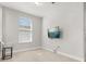 This bedroom has neutral carpet, a ceiling fan and a TV at 2405 Standing Rock Cir, Oakland, FL 34787