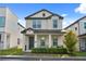 Charming two-story home featuring a covered front porch and well-maintained landscaping at 2405 Standing Rock Cir, Oakland, FL 34787