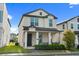 Charming two-story home featuring a covered front porch and well-maintained landscaping at 2405 Standing Rock Cir, Oakland, FL 34787
