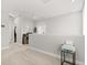 The upstairs hallway has neutral carpet and paint at 2405 Standing Rock Cir, Oakland, FL 34787