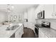 Modern eat-in kitchen featuring granite countertops, stainless steel appliances, and an open floor plan at 2405 Standing Rock Cir, Oakland, FL 34787