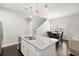 Open-concept kitchen island and dining area featuring hardwood floors at 2405 Standing Rock Cir, Oakland, FL 34787