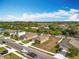 Aerial view of the street featuring well-maintained lawns, houses, and neighborhood streets at 2636 Grand Central Ave, Tavares, FL 32778
