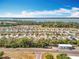 Aerial view of a residential neighborhood near a large body of water at 2636 Grand Central Ave, Tavares, FL 32778