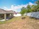 Lush backyard featuring a patio area, privacy fencing and ample room for landscaping and recreation at 2636 Grand Central Ave, Tavares, FL 32778