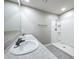 Bathroom featuring double sinks and a walk-in shower at 2636 Grand Central Ave, Tavares, FL 32778