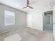 Bedroom showcasing a window, neutral paint colors, carpeted flooring and a ceiling fan at 2636 Grand Central Ave, Tavares, FL 32778