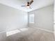 Bedroom showcasing a window, neutral paint colors, carpeted flooring and a ceiling fan at 2636 Grand Central Ave, Tavares, FL 32778