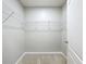 Walk-in closet with built-in shelving at 2636 Grand Central Ave, Tavares, FL 32778