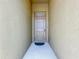 The front door offers both privacy and curb appeal, inviting guests into the home at 2636 Grand Central Ave, Tavares, FL 32778