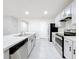 Spacious kitchen featuring a large island with sink, stainless steel appliances, and ample cabinet space at 2636 Grand Central Ave, Tavares, FL 32778