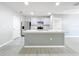 Contemporary kitchen offering a center island, stainless steel appliances, and sleek design at 2636 Grand Central Ave, Tavares, FL 32778