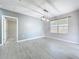 Well-lit living room with view to the window at 2636 Grand Central Ave, Tavares, FL 32778