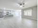 Well-lit living room with a breakfast bar and a window offering natural light at 2636 Grand Central Ave, Tavares, FL 32778