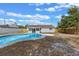 Aerial view of backyard with kidney-shaped pool, screened patio, and fenced perimeter at 2763 E Waco Dr, Deltona, FL 32738