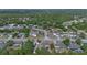 Expansive aerial view of a residential neighborhood featuring mature trees and well-maintained homes at 2763 E Waco Dr, Deltona, FL 32738