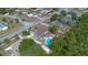 Aerial view of the home with the backyard pool, enclosed patio, and surrounding neighborhood at 2763 E Waco Dr, Deltona, FL 32738