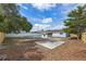 A fenced backyard featuring a pool, patio, and ample room for outdoor activities at 2763 E Waco Dr, Deltona, FL 32738