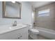 A bright bathroom features tiled shower, a new toilet and vanity, offering a clean and modern design at 2763 E Waco Dr, Deltona, FL 32738