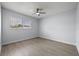 A light-filled bedroom with a ceiling fan and window, offering a comfortable and bright living space at 2763 E Waco Dr, Deltona, FL 32738