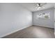 Bedroom featuring wood-look flooring and a window allowing natural light at 2763 E Waco Dr, Deltona, FL 32738