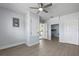Bedroom with wood-look flooring, ceiling fan, closet, and storage space at 2763 E Waco Dr, Deltona, FL 32738