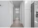 Hallway leading to bathroom with white cabinetry at 2763 E Waco Dr, Deltona, FL 32738