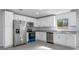 Beautiful kitchen featuring stainless steel appliances, granite countertops, and white cabinetry at 2763 E Waco Dr, Deltona, FL 32738