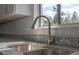 Close up of sink and granite countertop overlooking outdoor view at 2763 E Waco Dr, Deltona, FL 32738