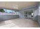 Enclosed patio featuring tile flooring, sliding glass doors, and multiple windows letting in natural light at 2763 E Waco Dr, Deltona, FL 32738