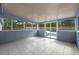 Enclosed patio with tiled floors and sliding glass doors leading to the pool at 2763 E Waco Dr, Deltona, FL 32738