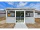 The enclosed porch boasts sliding glass doors leading to the pool, providing seamless outdoor access at 2763 E Waco Dr, Deltona, FL 32738