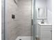 A tiled shower with glass door and a modern shower head, creating a luxurious and contemporary bathroom space at 2763 E Waco Dr, Deltona, FL 32738