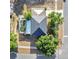 Aerial view of a home showcasing a screened-in pool, well-manicured yard and modern roof design at 2995 White Magnolia Loop, Clermont, FL 34711