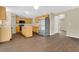 Well-lit kitchen features stainless steel appliances and an island with seamless flow into dining and living spaces at 2995 White Magnolia Loop, Clermont, FL 34711