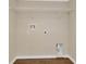Empty laundry room with washer hookups, dryer outlet, and wire shelving at 2995 White Magnolia Loop, Clermont, FL 34711