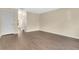 Open living room features include wood floors and a hallway leading to other areas of the home at 2995 White Magnolia Loop, Clermont, FL 34711