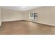 Inviting living room with hardwood floors, neutral paint, and a large window, creating a cozy atmosphere at 2995 White Magnolia Loop, Clermont, FL 34711