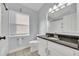 Bathroom featuring a sink with granite countertop, tile floor, and a toilet at 314 Lady Diana Dr, Davenport, FL 33837
