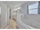 Bathroom featuring a garden tub, separate shower, tile flooring, and a sink with mirror at 314 Lady Diana Dr, Davenport, FL 33837