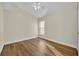 Bedroom features laminate wood flooring, white trim, neutral walls and a window at 314 Lady Diana Dr, Davenport, FL 33837