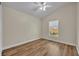 Bedroom features laminate wood flooring, white trim, neutral walls and a window at 314 Lady Diana Dr, Davenport, FL 33837