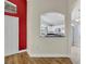 View of entryway and an opening into the kitchen area with white cabinetry at 314 Lady Diana Dr, Davenport, FL 33837