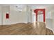 Open-concept living area featuring wood flooring, neutral walls, and natural light, creating a bright and inviting atmosphere at 314 Lady Diana Dr, Davenport, FL 33837