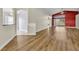 Spacious living room with beautiful wood floors, a high ceiling, and access to the backyard, perfect for entertaining at 314 Lady Diana Dr, Davenport, FL 33837