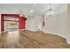 Spacious living room with beautiful wood floors, a high ceiling, and access to the backyard, perfect for entertaining at 314 Lady Diana Dr, Davenport, FL 33837